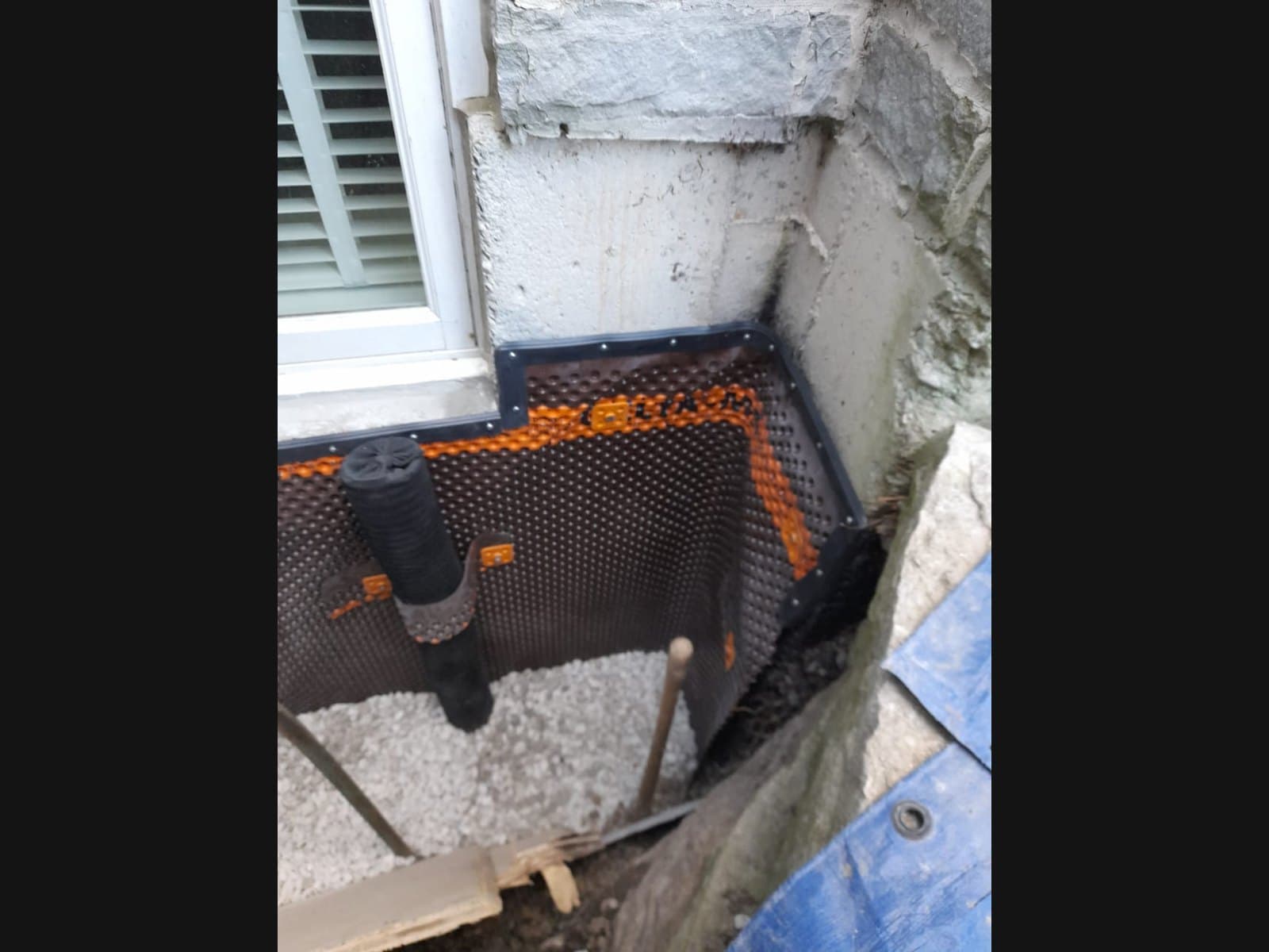 Interior dimpled membrane installation by Basement Waterproofing Wasaga Beach